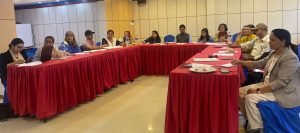 Participants sitting in roundtable and concentrating the presentation 