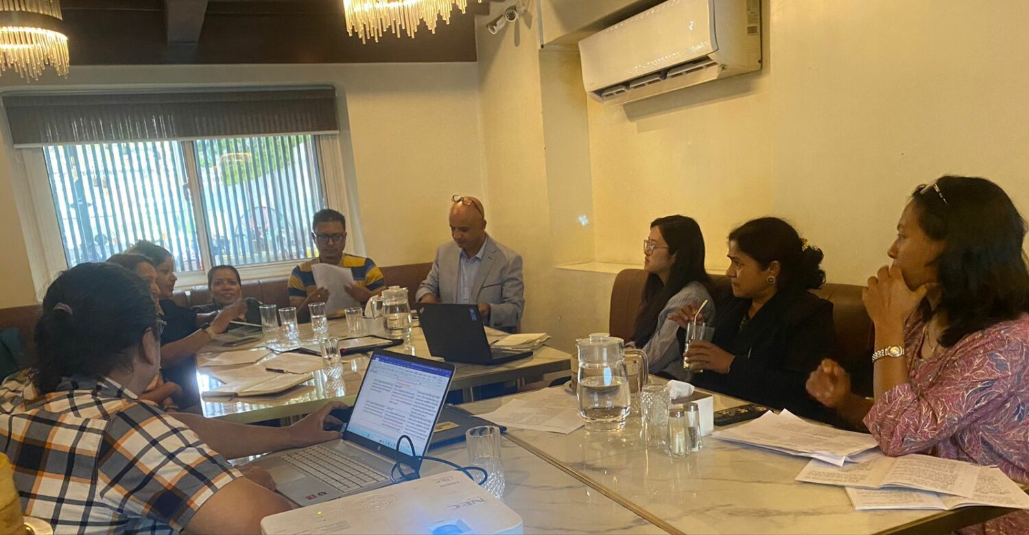 participants sitting in round table and discussing