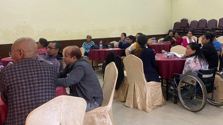 participants sitting in the hall and listening the presentation